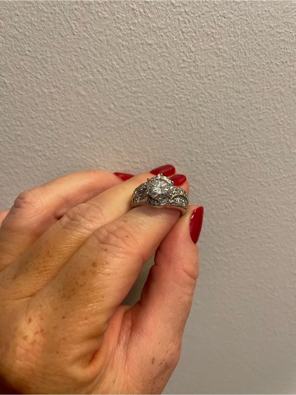 Elegant White Gold-Color Round Solitaire Ring with Accent Stones